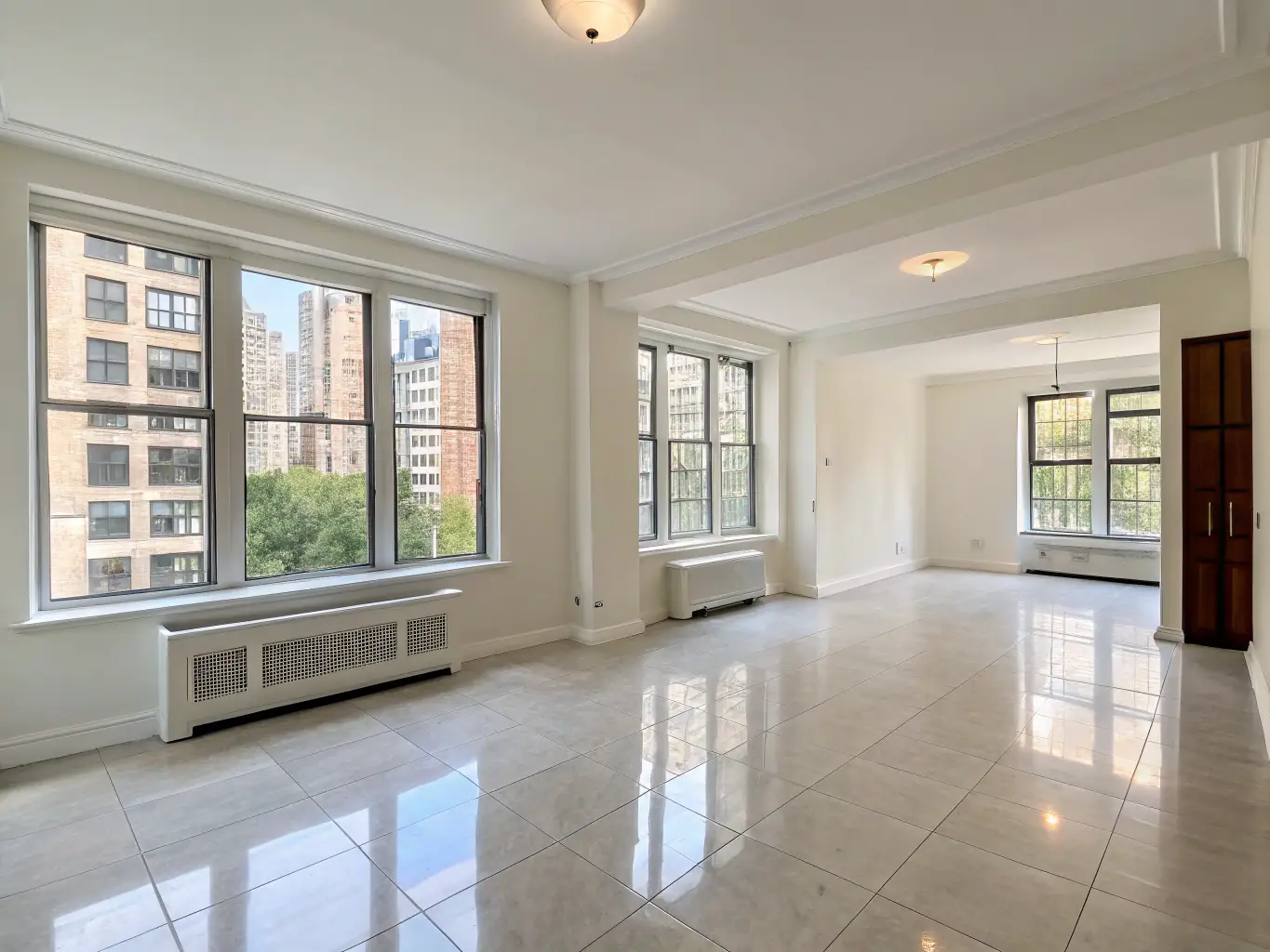 An empty apartment with freshly cleaned floors and windows, ready for new tenants, demonstrating Elevated Clean Co's move-in/move-out cleaning service.