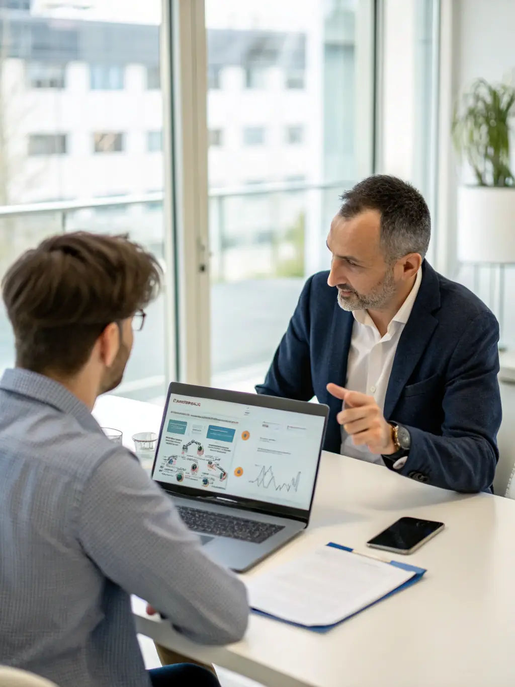 A consultant working with a client on a strategic plan, discussing business growth and optimization strategies in a modern office setting.